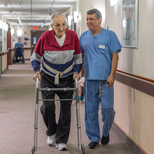 A CNA assists a resident